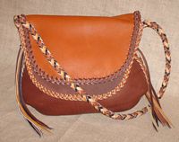  A front view of this multi colored leather purse. 
