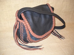  These two pictures are also of another custom, handmade bag. It's made with dark Brown leather and has Rust lacing. It is braided much like the other bags on this page. 