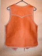  the back of this custom leather vest has a yoke and a draft flap extension 