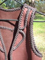 the split lapels of this two tone brown leather vest 