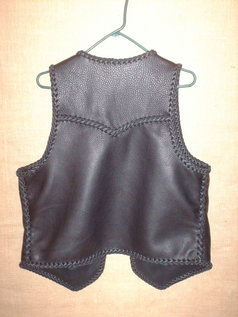  A view of the back of this vest offering a better look at the pointed yoke. 