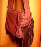  This back/side view of the purse shows a lot of its elaborate braided construction. 