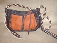  The bag of this medium size purse is done with two colors - dark Brown and Rust (pocket). The 8 strand braided strap and the tassels are done with four colors - dark Brown, Mahogany, Rust, and Pearl. 