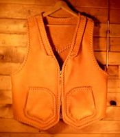  The guy that purchased this vest knew just what kind of pockets that he wanted - I rather like them. Besides those pockets, the vest has front lapels, a back pointed yoke, and a large brass (YKK #10) zipper. 