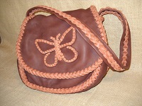  Here's another two tone version with a braided butterfly applique on the flap. 