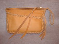  A clutch purse built with my braided construction. It has a full width front pocket and a wrist strap with tassels on the ends of it. 
