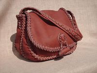  The front view of the custom handmade braided leather purse. 