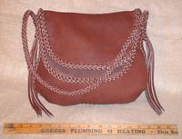  A front view of this handmade moccasin cowhide leather purse. 
