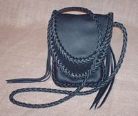  Here is a quite small double flapped bag - it would hold a checkbook on it's end. Often, I've built these with cross body shoulder straps. 