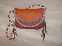  This picture shows the bag with the Rust colored flap prominent. 