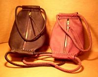 unique leather handbags with large brass zippers
