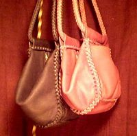 unique leather handbags that are similar, but, made in two different sizes