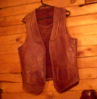  This (well used) vest has braided seams, edges, lapels, back yoke, and pockets. It's been worn by a bartender and has had many spills on it. It's one of the first items I published on my web site in 1999. 